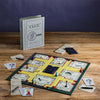 Clue board game in play. Clue Vintage Bookshelf Edition. A tribute to the classic 1949 game board and cards, wood movers with die-cast bases, die-cast weapons, pad of detective notes and 6 pencils.