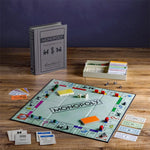 Game in play. Shown with stylish fabric-wrapped book, Vintage 1935 game board and cards, Deluxe removable bankers tray, Die-cast movers, Wood houses and hotels. Vintage Bookshelf Edition.